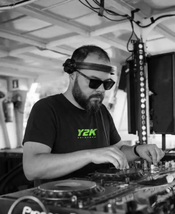 Performance Photo of DJ Producer Agent 47 using a Y2K Reloaded T-shirt
